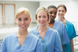 Four female Nurses smiling
